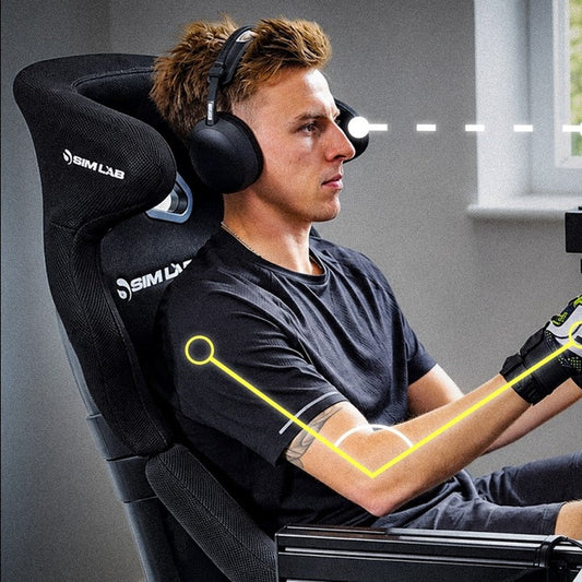 Sim racer in a Sim-Lab bucket seat with elbow angle and eye level marked at the wheel
